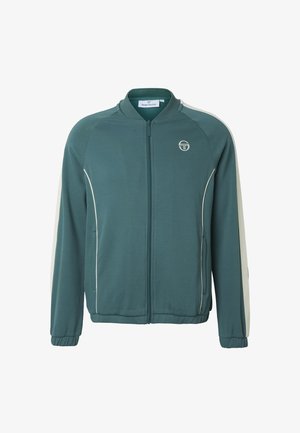 Turkis zip-up jakke med hvite sidestriper og piping, elastiske mansjetter og en liten rund logo på venstre bryst.