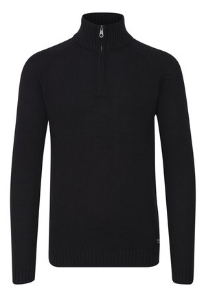 Must mustriteka kaelusega must särk, millel on tekstuuriga kudumine, pikad varrukad ja soonikkoes mansetid. Kaeluses on pool tõmblukk.