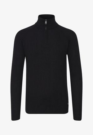 Must mustriteka kaelusega must särk, millel on tekstuuriga kudumine, pikad varrukad ja soonikkoes mansetid. Kaeluses on pool tõmblukk.