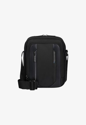 Borsa a tracolla nera compatta con tracolla regolabile, tasca anteriore con zip e design elegante, adatta per l'uso quotidiano o per viaggi.