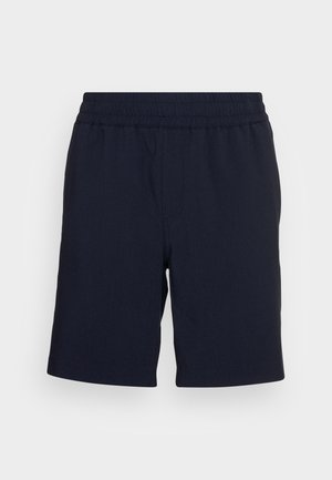 Temno modri kratki hlače z elastiko v pasu, izdelane iz mehke tkanine, z ravnimi hlačnicami in brez vidnih žepov ali vzorcev.