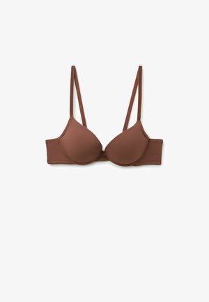 Bruine gevoerde beha met verstelbare banden, naadloze cups en een haak-en-oogsluiting. Gemaakt van zachte, rekbare stof voor comfort.