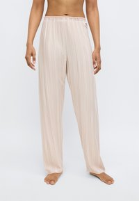 Pantaloni leggeri a righe color blush con vita elasticizzata. Design fluido e vestibilità ampia per il massimo comfort, adatti per un uso casual.