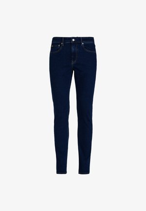 Jeans skinny blu scuro realizzati in denim con una texture liscia, caratterizzati da un classico design a cinque tasche e cuciture a contrasto.