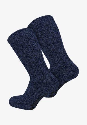 Marineblaue gestrickte Socken mit einem gerippten Muster, strukturiertem Stoff und einer gepolsterten Sohle für zusätzlichen Komfort.