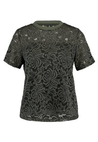 Top corto de manga corta en verde oscuro con estampados florales, un escote redondo y un diseño texturizado. La base es ligeramente transparente.