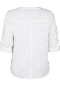 Weiße, halbtransparente Bluse mit langen Ärmeln, umgeschlagenen Manschetten und abgerundetem Saum; verfügt über ein dezentes Texturmuster und eine mittige Naht auf der Rückseite.