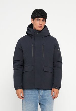 Navy blue insulated jacket with a hood, featuring two chest pockets and a side pocket. Smooth texture, zip and snap closures.