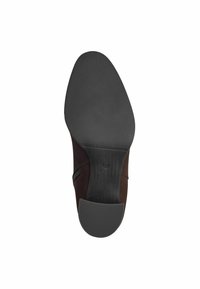 Brown shoe with a smooth suede upper and textured rubber sole. Features a side zipper and rounded toe design, with clearly marked size.