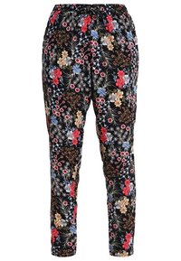 Black floral pants feature a variety of colorful flowers, with an elastic waistband and a tapered design. Made from a lightweight fabric.