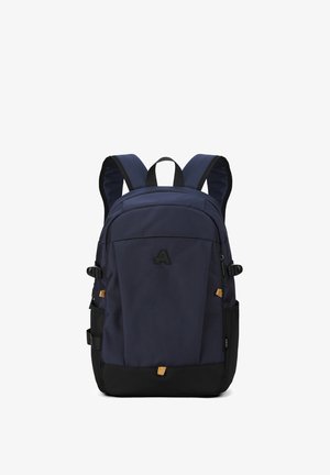 Sac à dos bleu marine avec base noire, en matériau textile, bretelles rembourrées, poche zippée à l'avant et logo sur le devant.