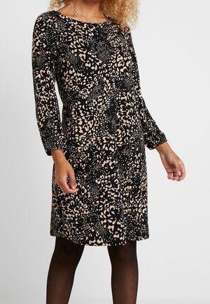 Zwarte jurk met een bloemrijke luipaardprint in beige. Lange mouwen en een ronde halslijn, gemaakt van een zachte, comfortabele stof.