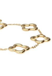 Collana in metallo dorato con maglie a forma di fiore con centro vuoto, dalla texture liscia e finitura lucida. Le maglie sono collegate da piccole sezioni di catena.
