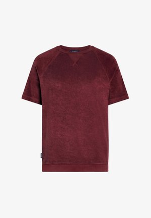 Kurzärmliges bordeauxrotes Frotteehemd mit Rundhalsausschnitt und "V"-Steppdetail am Kragen, ausgestattet mit einem kleinen Seitenschild.