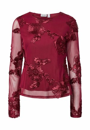Bordo caurspīdīga blūze ar garām piedurknēm, ziedu samta aplikācijām un apaļu kakla izgriezumu.
