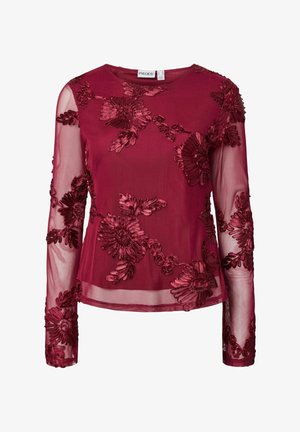 Bordo caurspīdīga blūze ar garām piedurknēm, ziedu samta aplikācijām un apaļu kakla izgriezumu.