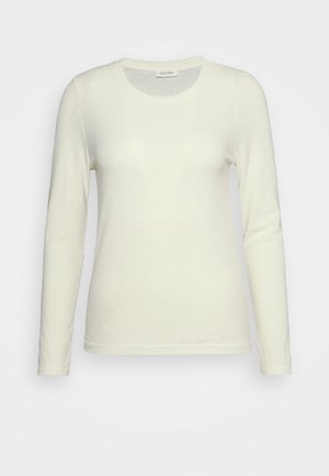 Langermet, elfenben ribbet skjorte med rund hals. Myk tekstur, tettsittende design og subtile kantdetaljer. Passer for lagdeling.