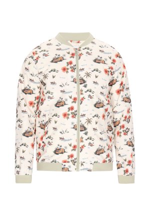 Blomstrede bomberjakke i creme med grønne kanter, der har et tropisk mønster af blomster, huse, både og palmetræer på blødt stof.