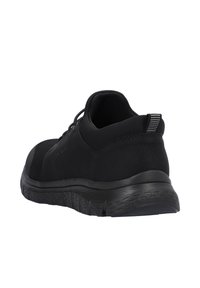 Black athletic shoes featuring a textured leather and mesh upper, a cushioned sole, and a striped pull tab at the back for easy wear.