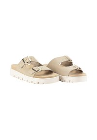 Sandalias beige con dos correas anchas, hebillas metálicas y una suela de plataforma blanca gruesa. Parte superior de ante suave con un acabado texturizado.