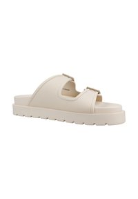 Beige rubber instapsandaal met een textuurlijke band en verstelbare gesp, voorzien van een dikke, gegroefde buitenzool voor extra grip en comfort.