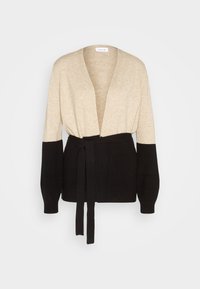 Beige och svart stickad cardigan med långa ärmar, öppen framsida och svart bälte i midjan.