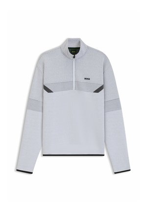 Light gray zippered pullover made of textured fabric. Features a geometric pattern at the chest with black accents on the sleeves and hem.