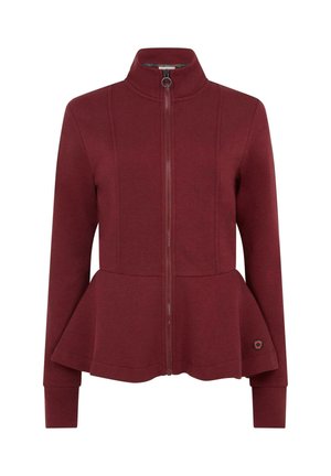 Giacca bordeaux con zip, orlo a peplo, polsini e colletto a coste. Tessuto liscio con dettagli a cucitura e accento logo vicino all'orlo.