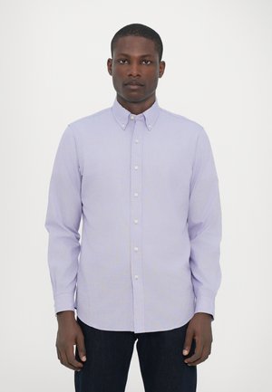 Light purple button-up shirt with a collar, long sleeves, and white buttons. Smooth texture, tailored fit, and curved hem detail.