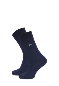 Granatowe skarpetki bawełniane z mankietami prążkowanymi i małym szarym logo. Gładka faktura i tradycyjny design skarpetek, odpowiednie na co dzień.