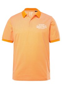 Pánská polokošile v světle oranžové barvě s oranžovým límečkem. Na levé straně se nachází bílé logo. Vyrobena z texturované tkaniny. Krátké rukávy.