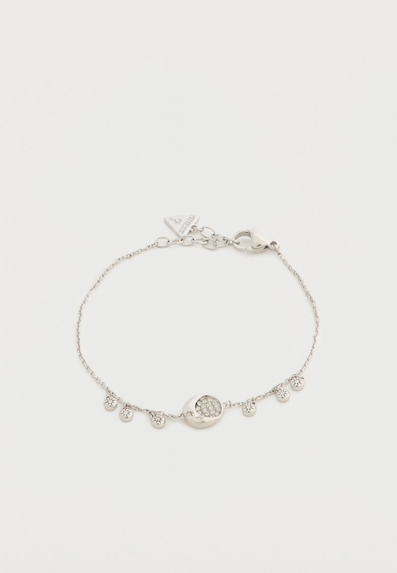 Bracelet à chaîne en argent avec un pendentif ovale central incrusté de petits cristaux et six petits pendentifs ronds espacés uniformément le long de la chaîne.