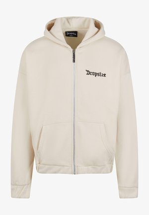 Cremfarbener Reißverschluss-Hoodie mit einer Fronttasche und gesticktem "Dropsize"-Logo in Schwarz. Mit Kordelzugkapuze und gerippten Bündchen.
