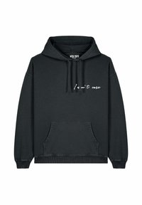 Felpa nera in cotone con tasca frontale, cappuccio con coulisse e testo in corsivo bianco "Non mi interessa" sul davanti. Tessuto morbido, vestibilità comoda.