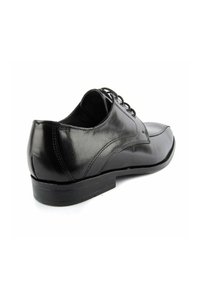 Schwarze Lederdressschuhe mit glatter Textur, runder Zehenform, Schnürdesign, niedrigem Absatz und dezenten Stickdetails an den Seiten.