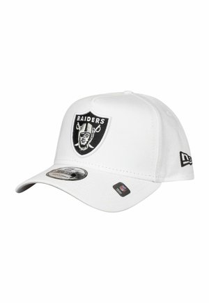 White baseball cap with a rounded visor, featuring a black Raiders logo on the front, additional branding on the side, made of smooth fabric.
