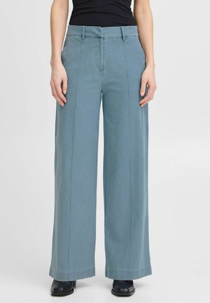 Lichtblauwe wijde broek van katoen met een gladde textuur. Voorzien van een knoopsluiting, riemlussen en voormiddenplooien.