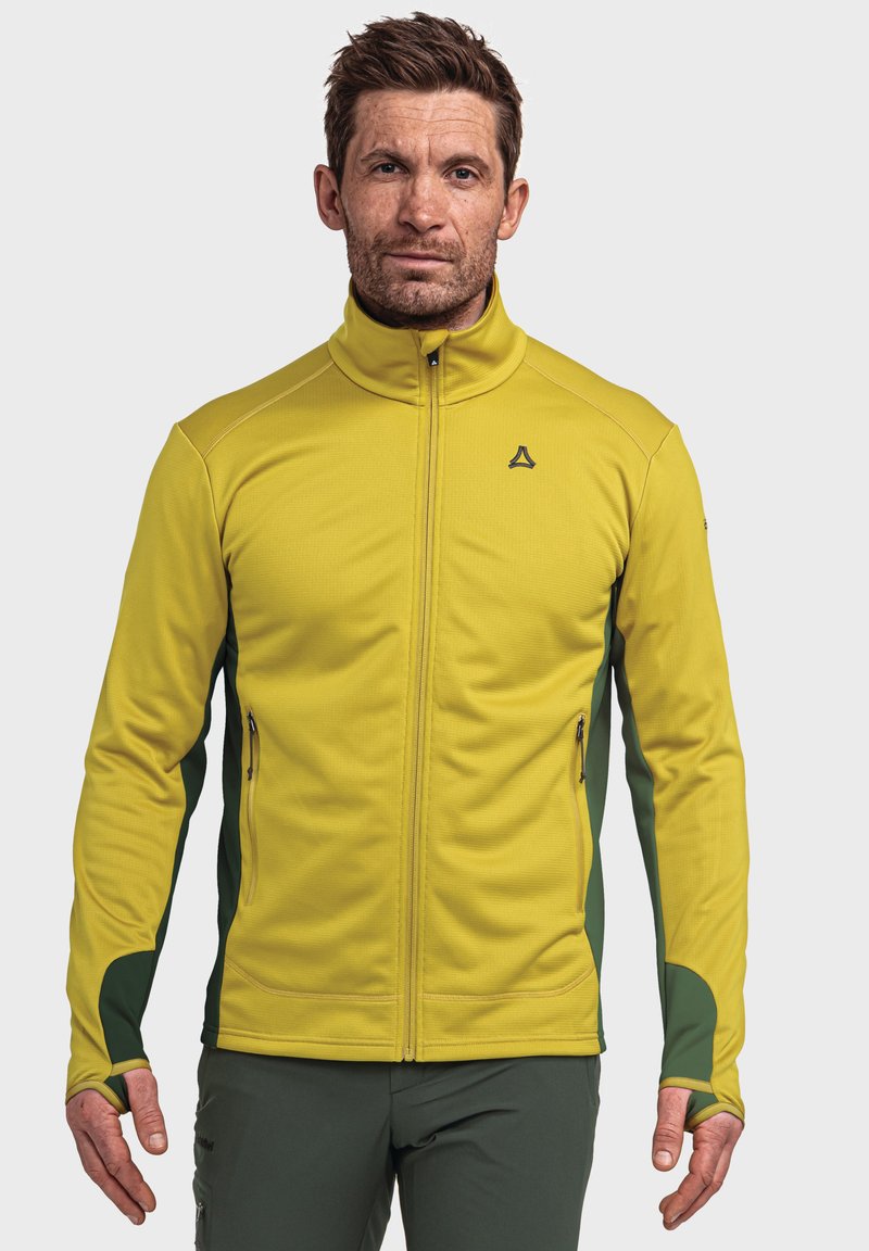 Gelbe Zip-Jacke aus strukturiertem Stoff, mit grünen Seiteneinsätzen, Daumenlochärmeln und einem geprägten Logo auf der Brust.