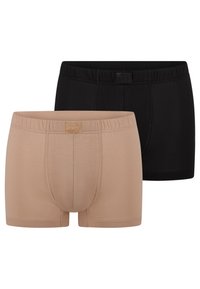 Dwie pary męskich bokserek w jednolitych kolorach: czarnym i beżowym, z elastycznymi pasami i delikatną fakturą materiału.