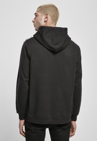 Starter REGULAR FIT - Jersey con capucha - black
