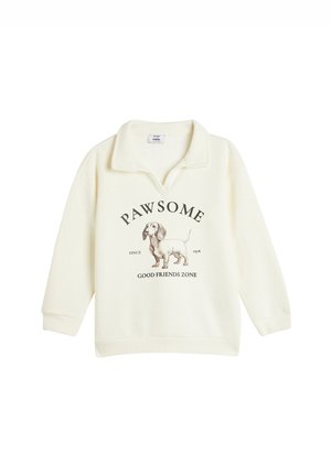 Sweatshirt color crema con colletto, presenta un graffico di un bassotto e il testo "PAWSOME SINCE 1978 GOOD FRIENDS ZONE" sottostante.