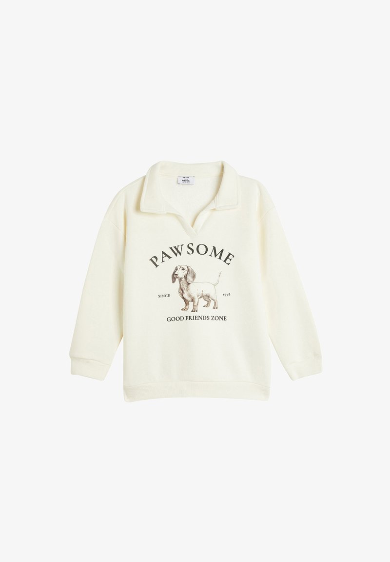 Sweatshirt color crema con colletto, presenta un graffico di un bassotto e il testo "PAWSOME SINCE 1978 GOOD FRIENDS ZONE" sottostante.