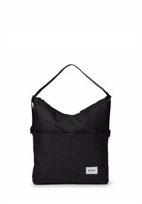 Sac à bandoulière noir rectangulaire avec une seule sangle, une poche avant et une petite étiquette logo rectangulaire portant l'inscription "KCB" dans le coin inférieur.