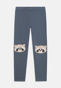 Gray leggings feature two cartoon raccoon faces on the knees, made from soft fabric with a smooth texture and elastic waistband.