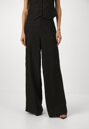 PRIYA - Trousers - black