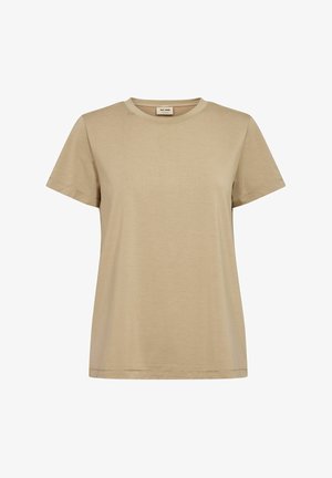 Beżowa damska koszulka z krótkim rękawem i okrągłym dekoltem, z małą metką na karku, przedstawiona na białym tle.