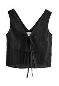Top cropped nero con scollatura a V, decorato con motivi ad occhio ricamati lungo i bordi e chiusura anteriore a fiocco. Tessuto liscio, design senza maniche.