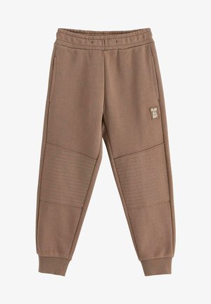 Brown sweatpants made from soft fabric, featuring a ribbed waistband, side pockets, and textured panel accents on the thighs.