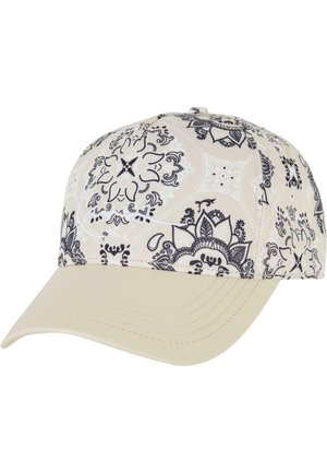 Cream baseball cap featuring intricate black floral patterns, a curved bill, and stitched detailing along the seams.