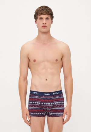 Hugo Herrenboxershorts in Marineblau, mit einem Muster aus weißen und roten geometrischen Designs. Softes Material und ein Logo-Bund.